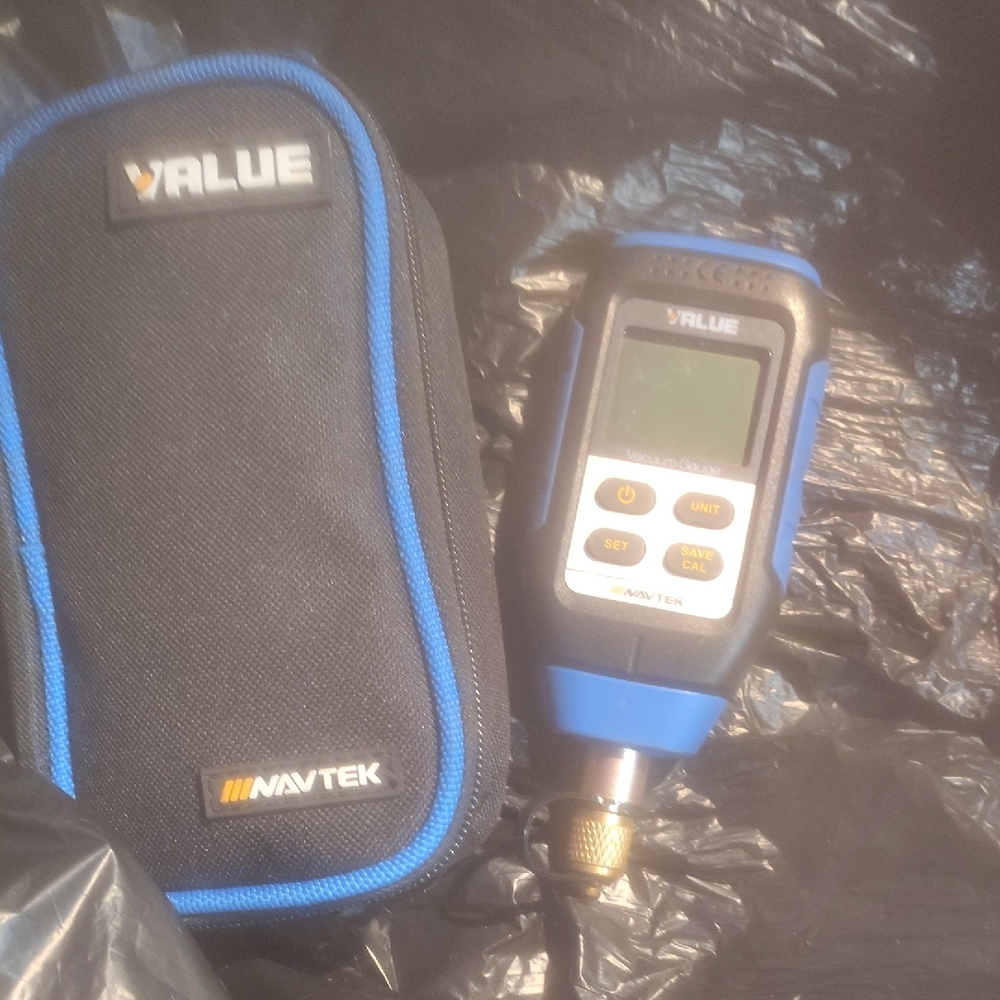 Blue and Black Navtek Vacuum Gauge With Case
